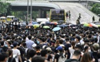 Les manifestants paralysent Hong Kong, report de l'examen d'un texte controversé